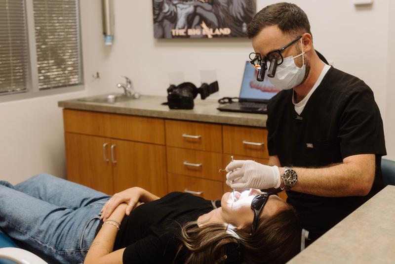 Dr. Lassiter providing clinical care to a patient